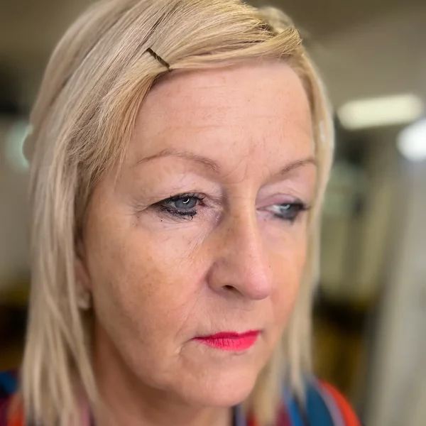 Sparse blonde brows in natural light before semi-permanent eyebrow tattoo