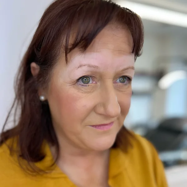 Asymmetric thin uneven brows on mature blonde before brow symmetry tattoo