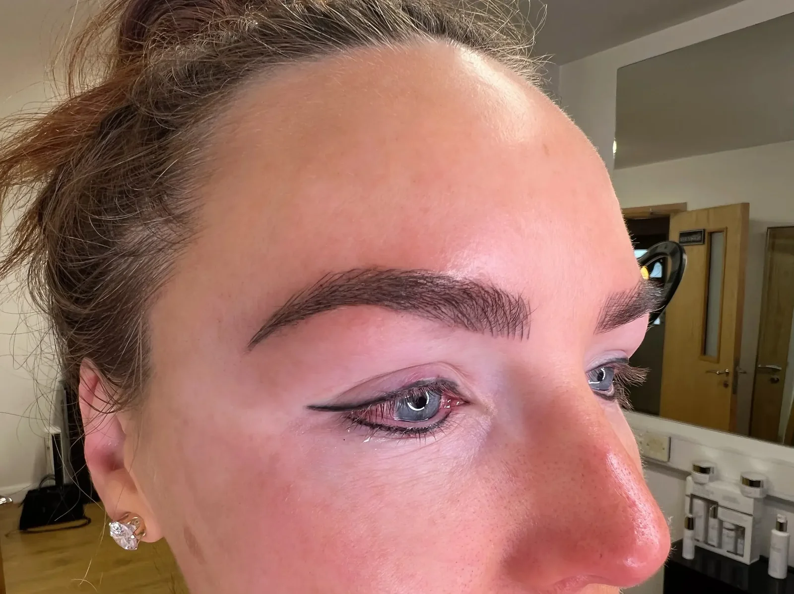 Bare lash line on mature freckled client before eyeliner tattoo — By Lorraine, Gold Coast