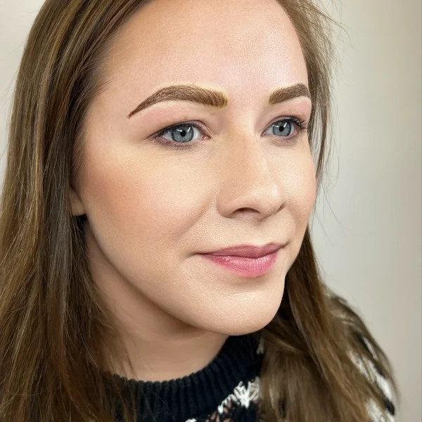 Fresh eyebrow tattoo — warm brown bespoke colour on brunette client by Lorraine