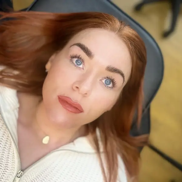 Semi-permanent lip makeup — soft rose portrait, redhead client